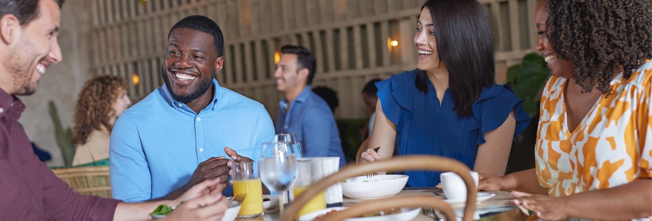 Man socializing with friends in a restaurant 